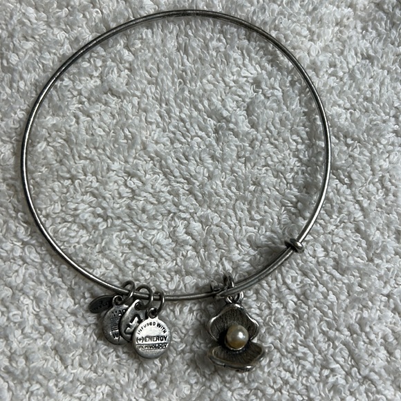 Alex and Ani bangle in silver featuring a Pearl in a oyster shell charm. - Picture 4 of 4
